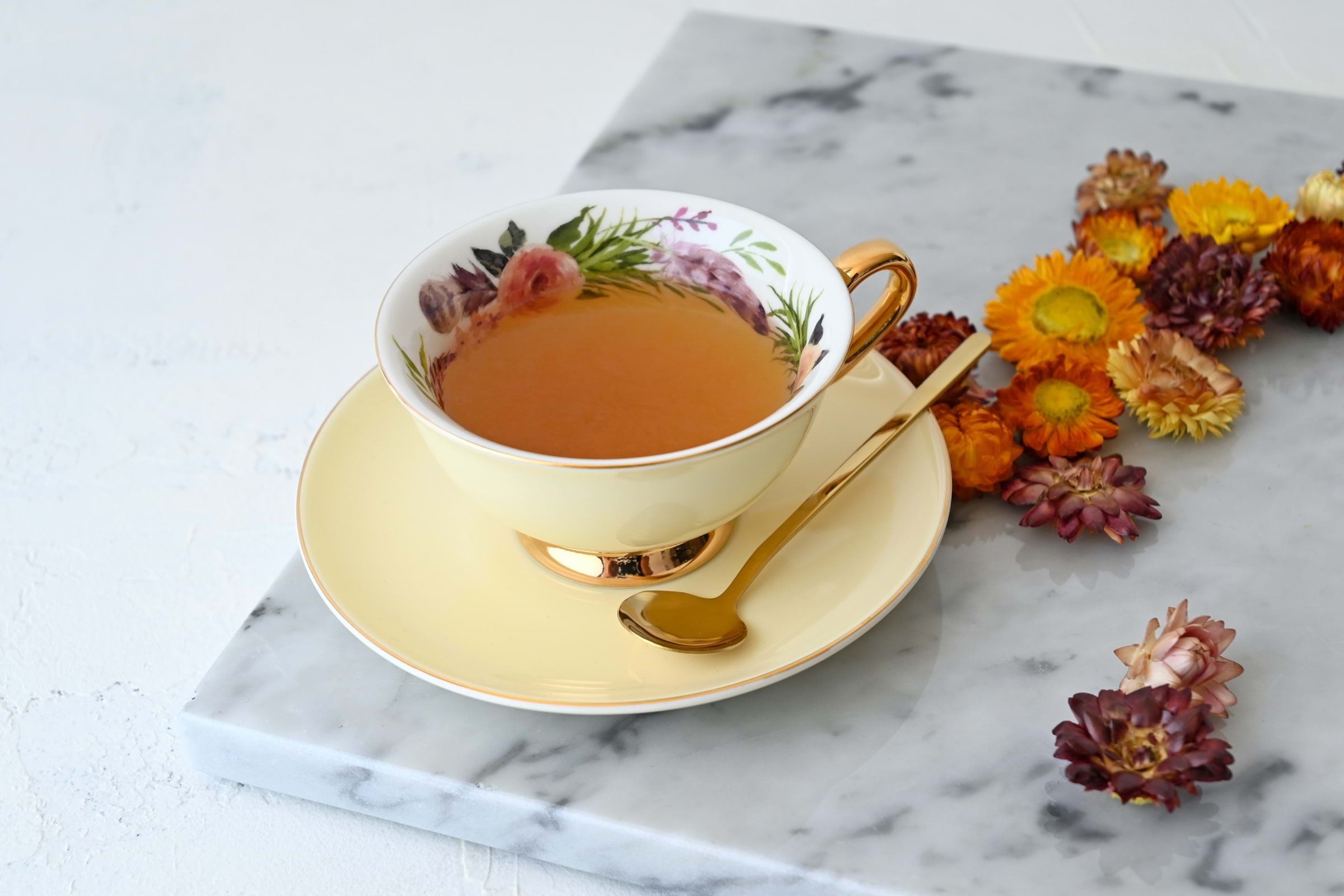 A pretty cup of tea on a marble slate