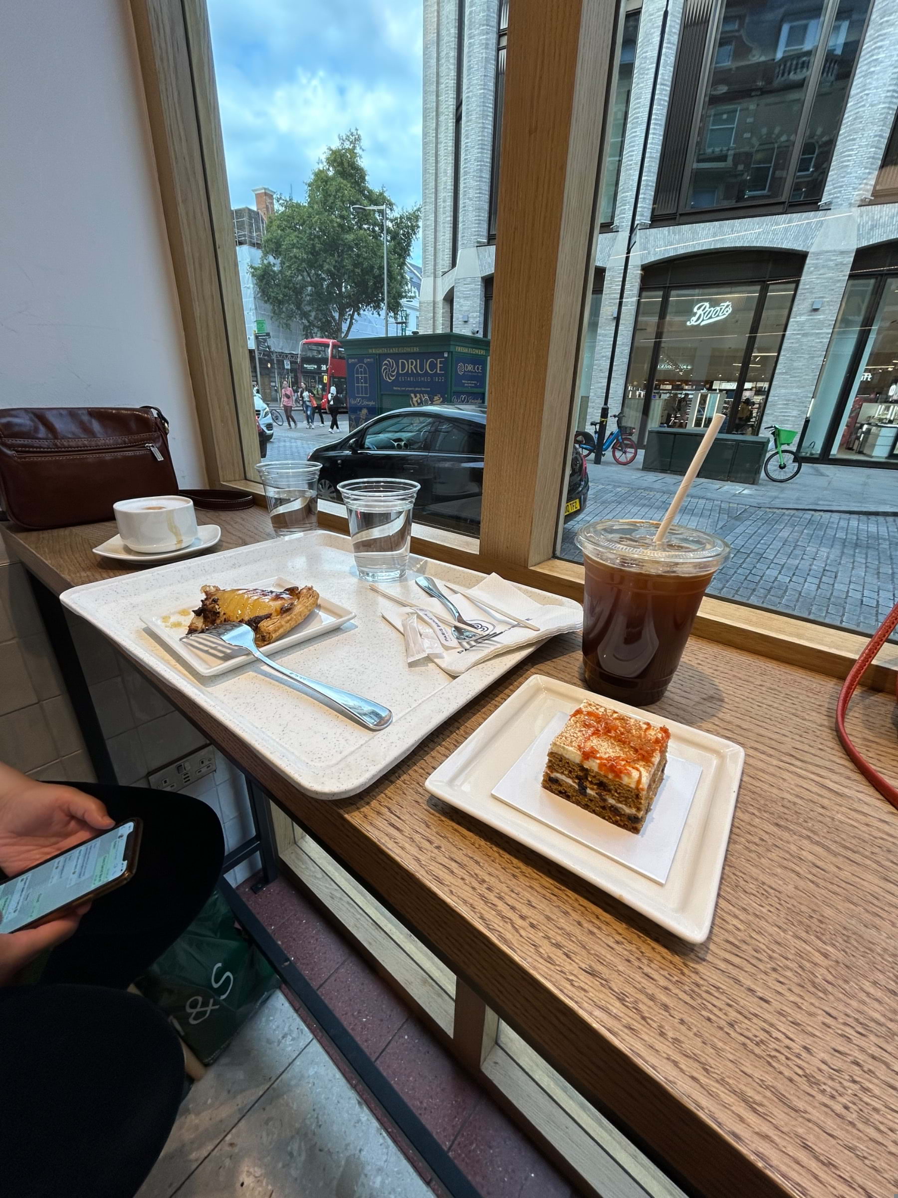 Carrot cake with iced Americano and pommes tart – Photo from Paris Baguette High Street Kensington by Madiha S. (04/08/2023)